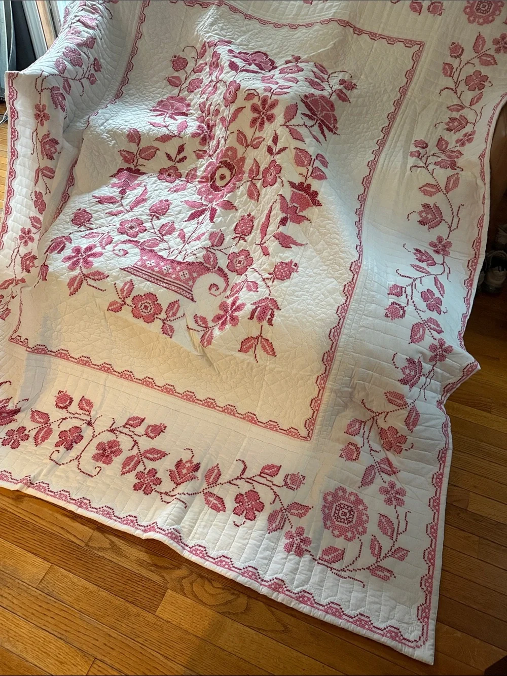 White Quilt with Pink Floral Basket Motif